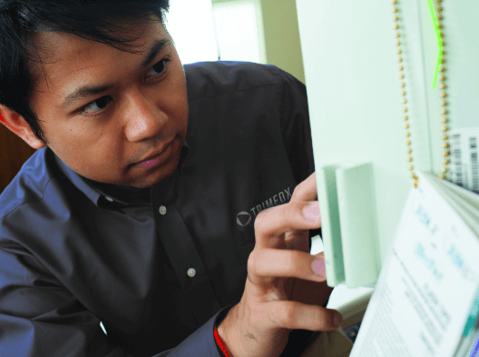 Biomed technician working on a connected medical device 